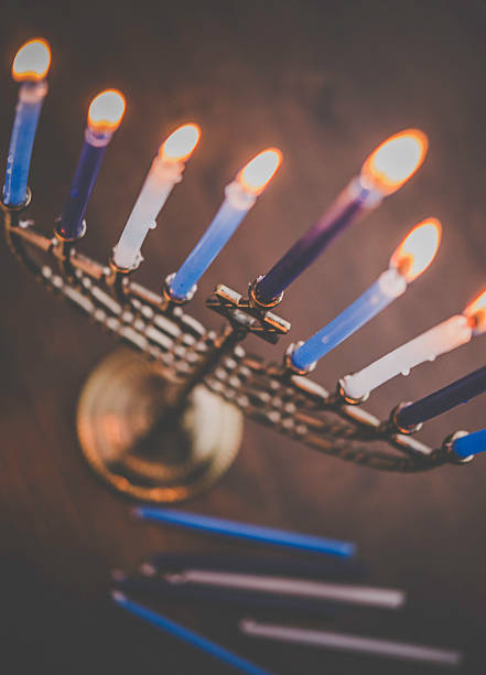 View from above of Menorah with burning candles. Hanukkah preparations View from above of Menorah with burning candles. Hanukkah preparations hanukkah candles stock pictures, royalty-free photos & images