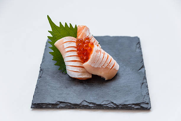 istock Medium Rare Salmon Sashimi in Stone Plate. 637021338