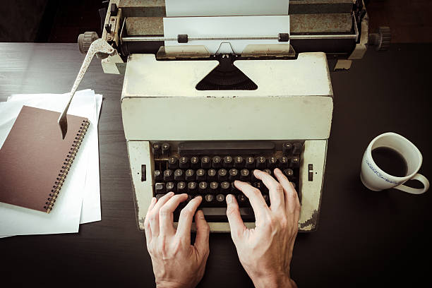 istock Male hands typing on typewriter on the desk. 637021954