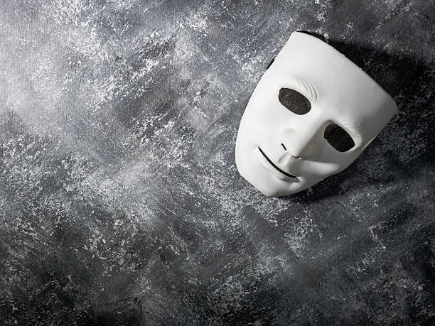 istock White mask on gray grunge background. 637023572