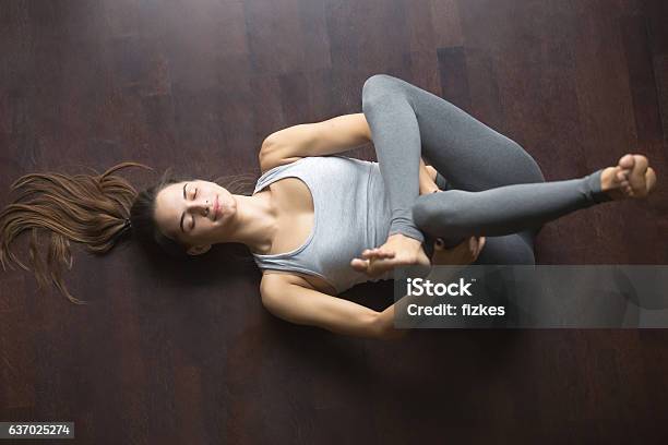 Top View Of Eye Of The Needle Yoga Pose Stock Photo - Download Image Now - Stretching, Hip - Body Part, Yoga