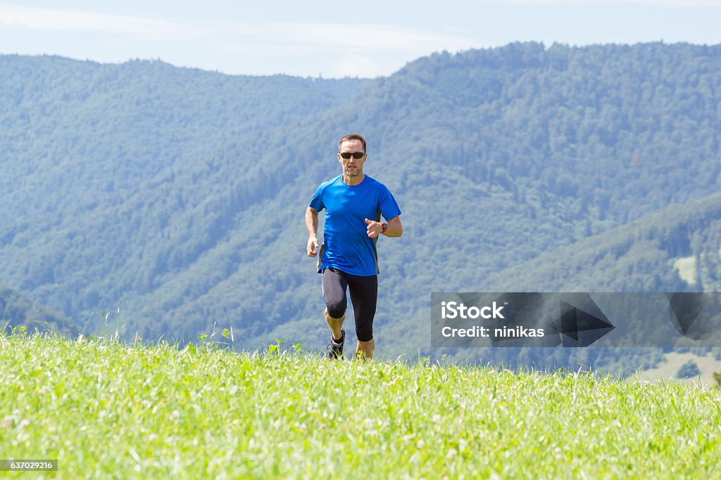 Man Running Ground Man Running At Mountain Background Stock Photo - Download Image Now ...