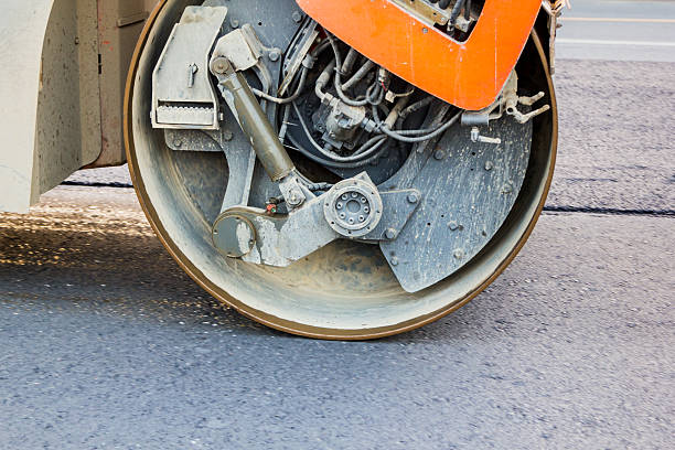 istock road roller working on the new asphalt road 637032386
