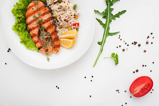 istock Grilled red fish on vegetable risotto free space 637032634