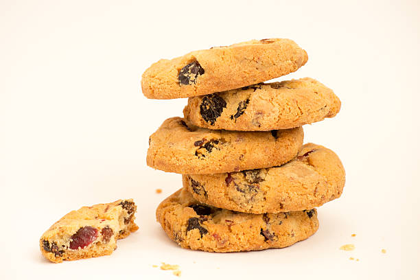 istock Cookies with raisins folded pile on a white background 637032660