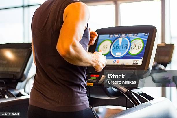 Athletic Runner Running On Treadmill In Gym Stock Photo - Download Image Now - Treadmill, Computer Monitor, Men