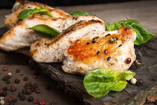 Photo of Grilled turkey fillet with appetizing roasted crust garnish spin