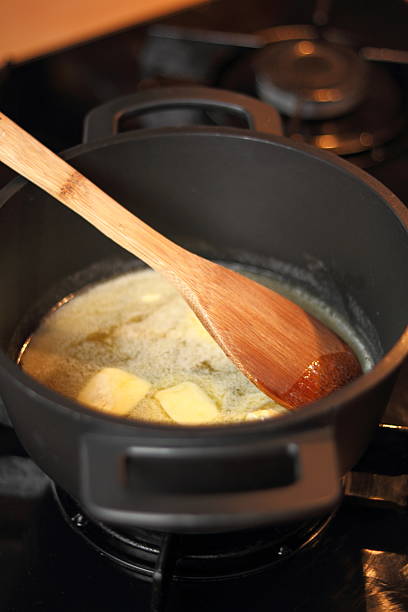 istock Melting butter with honey. Making Gingerbread Cookies Series. 637034470