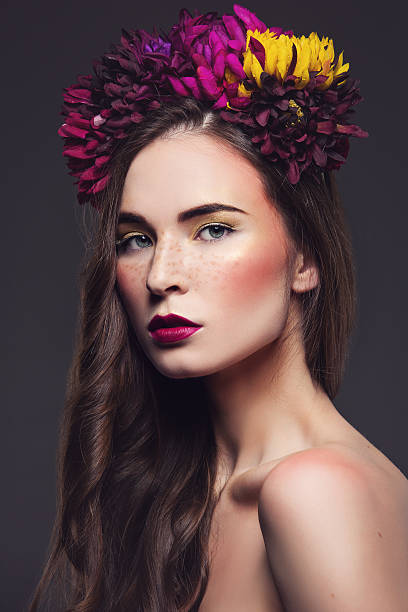 istock Beautiful girl with flowers on head 637034778