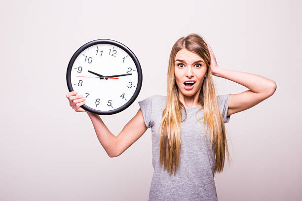 istock Shocked girl because be late at clock time 637036042