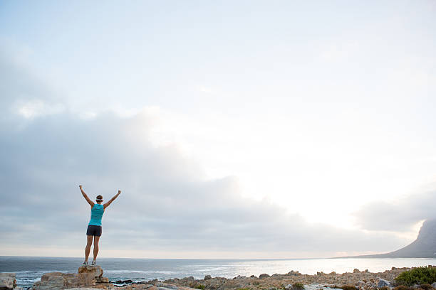 istock Success - female with arms outstretched 637037608