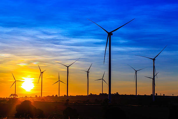 istock Wind turbines farm at the sunset 637038424