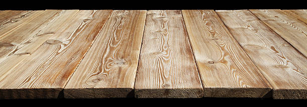 istock Image of empty wooden tabletop over black 637039372