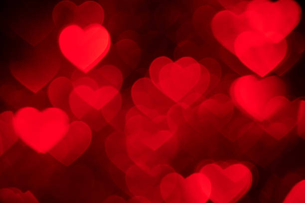 istock red heart bokeh background photo, abstract holiday backdrop 637040946