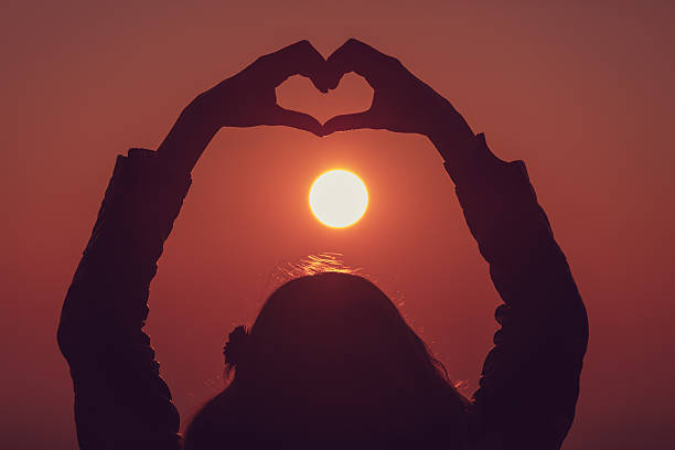 istock Girl making a heart-shape outdoors. 637041106