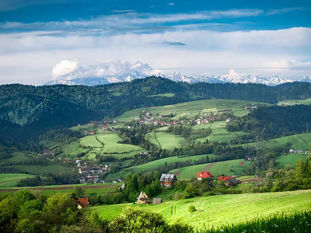 View of Pieniny and High Tatras from Gorce mountains. Village Tylka.