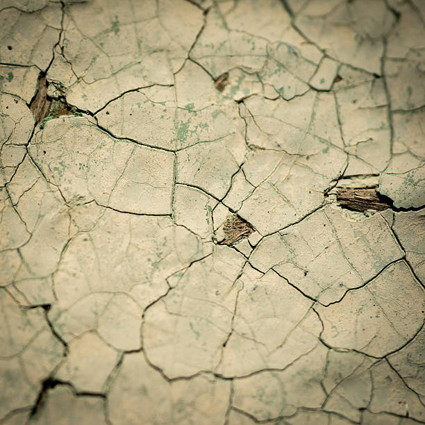 Wooden wall with cracked paint vignetting square background
