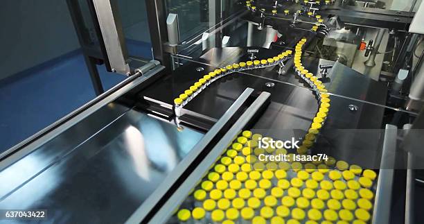 Automated Line For Marshalling Bottles Of Drugs Stock Photo - Download Image Now - Medicine, Manufacturing, Industry