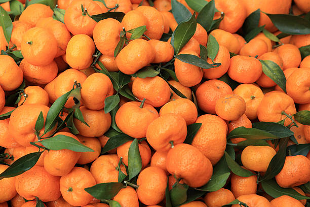 istock fresh oranges selling at market 637043986