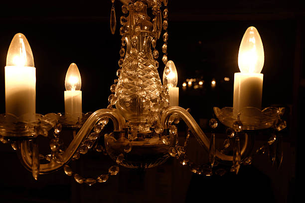 istock glowing chandelier on a black background 637044012