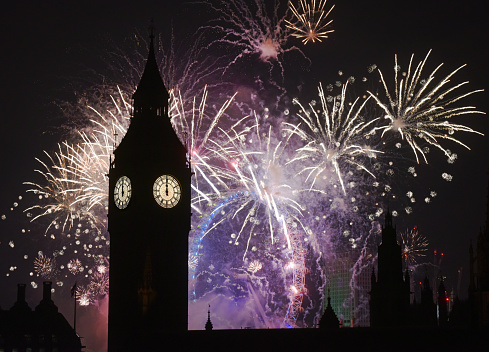 Spectacular fireworks cast Big Ben into silhouette at midnight of New Year's Eve