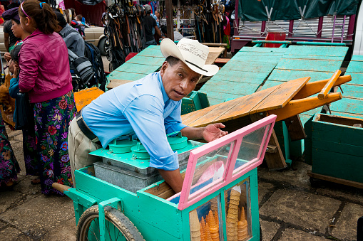 San Cristobal de Las Casas, Mexico - May 10, 2014: A man selling Ice Creams in a street market in the city of San Cristobal de Las Casas in the Chiapas region, Mexico.