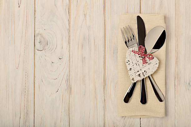 istock Valentine's day concept. On the wooden table cutlery 637051842