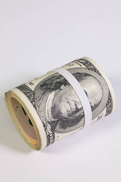 istock The roll of dollar bills with plastic band over eyes 637053086