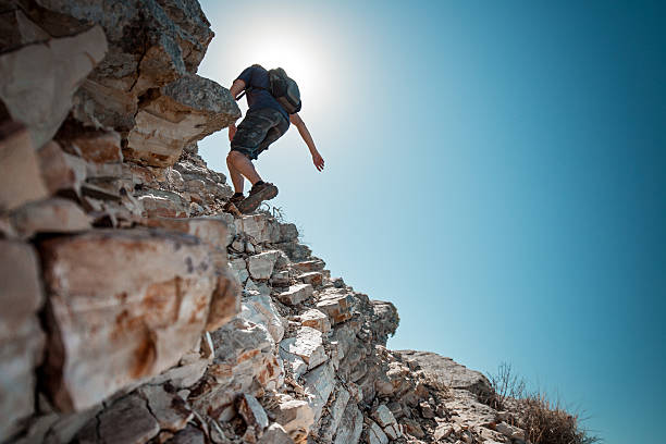Hiker crossing rocky terrain in the Bryce Canyon National Park, USA
