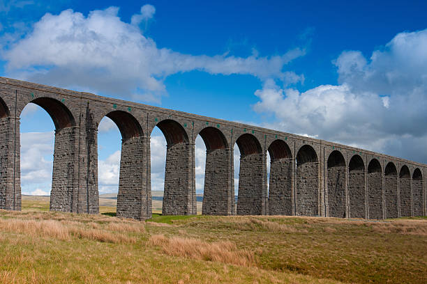 Ribblehead Viaduct in the Yorkshire Dales,England Famous Ribblehead Viaduct in the Yorkshire Dales on a sunny day, England ingleborough stock pictures, royalty-free photos & images