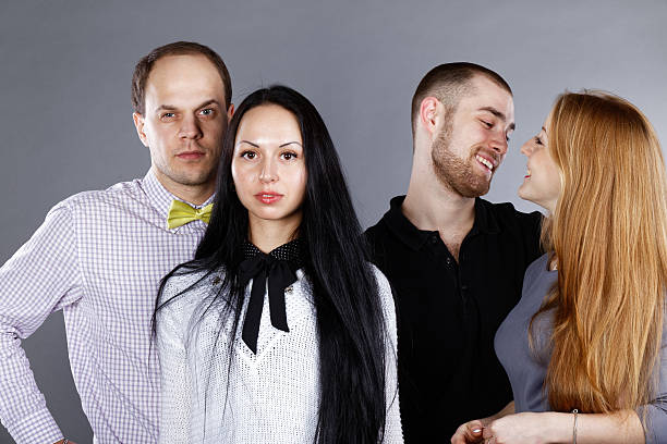 istock Portrait of two couples on a gray background 637060282