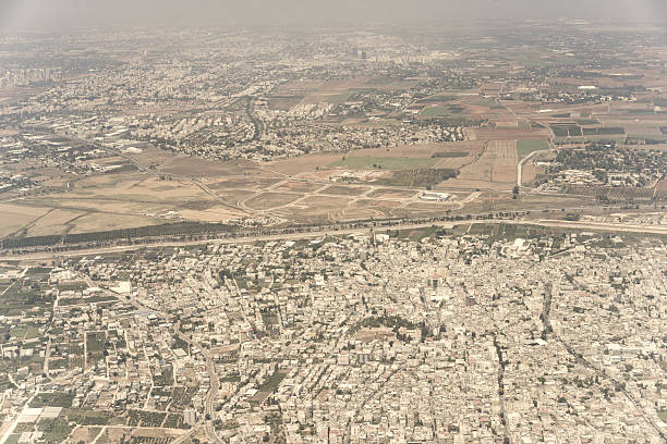 Old buildings, fields and new skyscrapers in Tel Aviv, Israel stock photo