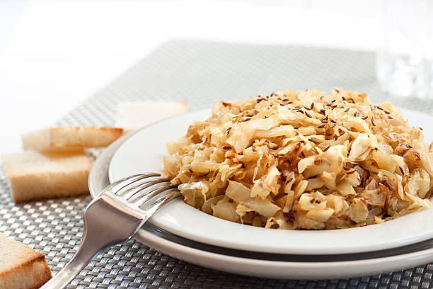 istock Fried cabbage with caraway and garlic on a plate 637063254