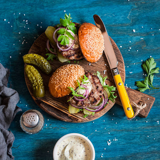 istock Two homemade beef burger on a wooden board. 637063996