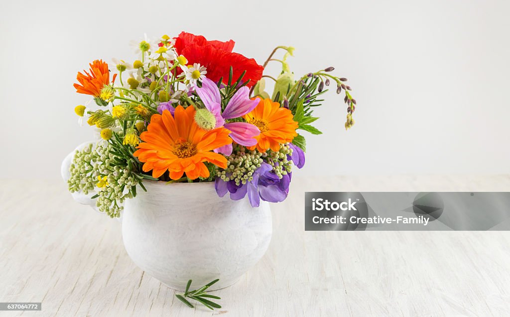 Decorative flowers in a white vase Decorative fresh flowers in a white vase Bouquet Stock Photo