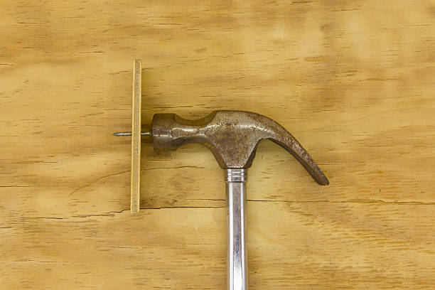 istock top view of hammer and nails 637066340