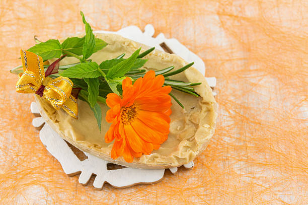 istock Herbal soap and marigold flower 637068858