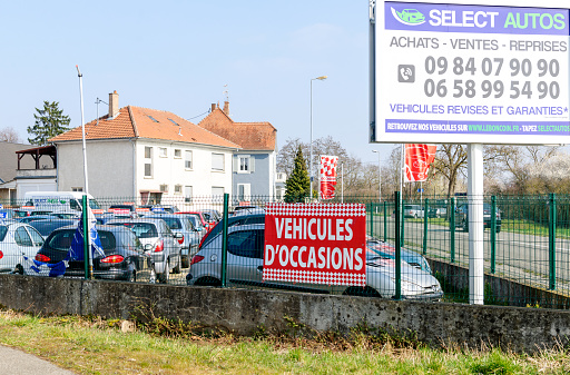 Strasbourg, France - March 20, 2016: Vehicules d'Occasion translating as Used Cars garage outside the city of Strasbourg with large selection of French and German cars - Renault, Peugeot, Citroen, Vw, Ford