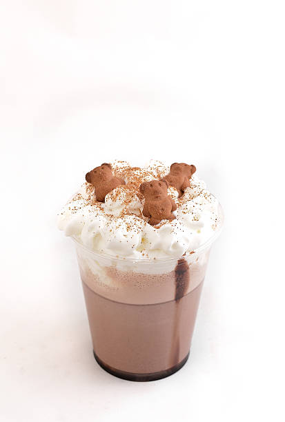 istock Hot chocolate with whipped cream in mug isolated on white 637069866