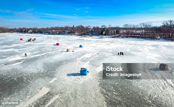 Ice Fishing On A Warm Winter Day Stock Photo - Download Image Now - Wisconsin, Fishing, Green Bay