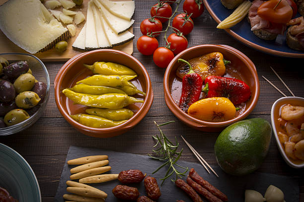 istock Spanish tapas starters on wooden table 637070300