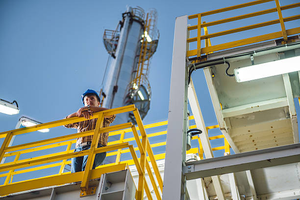 istock Man standing at natural gas facility 637070650