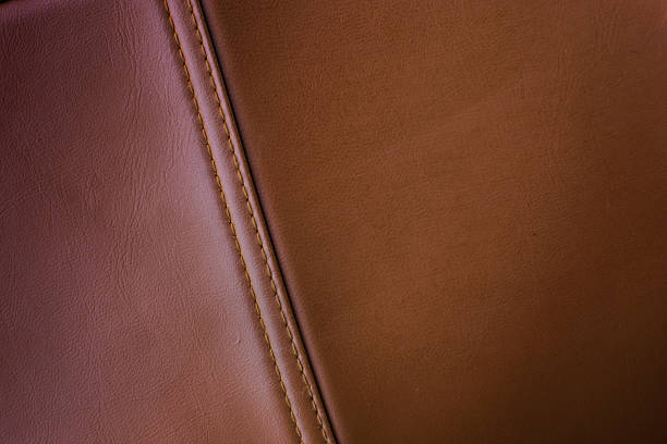 istock Bag brown leather with seam close up 637073298