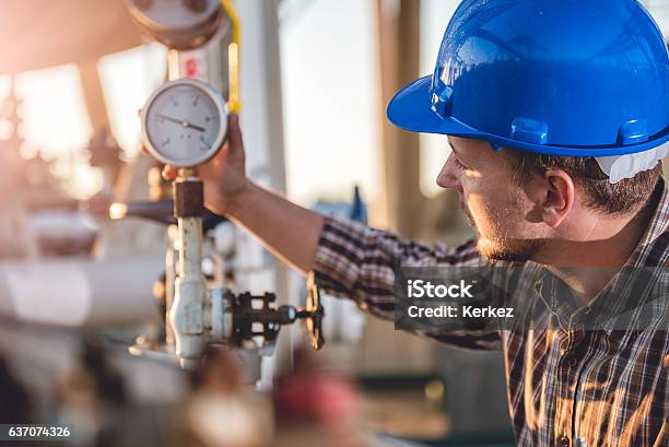 Man Checking Manometer Stock Photo - Download Image Now - Natural Gas, Gasoline, Propane