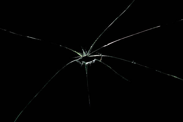 istock Broken Cracked Glass on black background 637078300