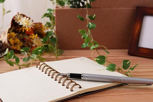 Notebook and pen on the table