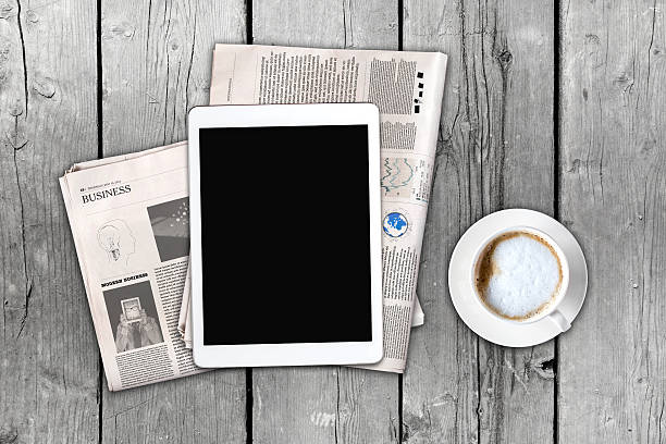 istock Daily newspaper, coffee and tablet with a blank screen. 637078626