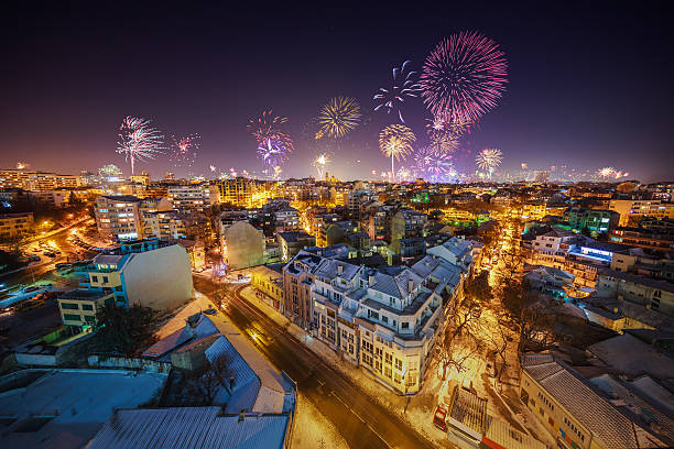 istock Downtown Varna cityscape with flashing fireworks celebratining 637079536