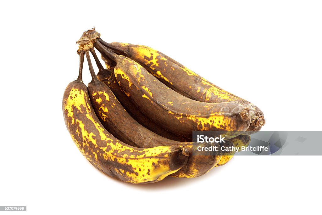 Overripe Bananas Photograph of a bunch of overripe bananas set against a white background.  Perfect for making banana bread! Banana Stock Photo