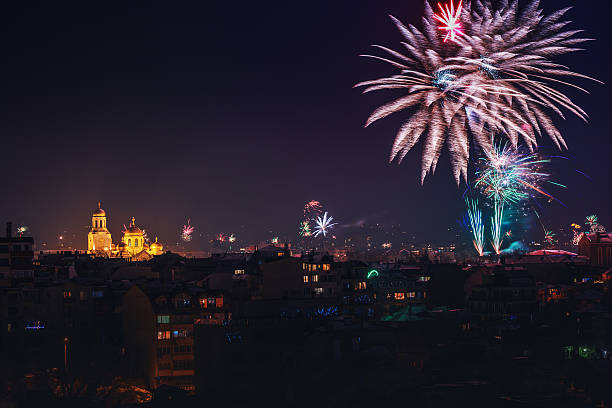 Downtown Varna cityscape with many flashing fireworks celebrating New Year's Eve